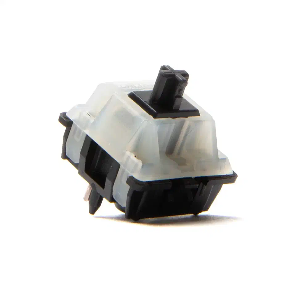 Cherry MX Black Clear-Top Nixie switch with milky translucent housing and black stem