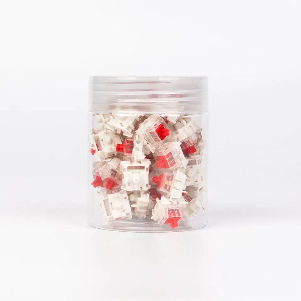 Gateron Silent Red switch with transparent top housing and milky base showing the silicone-dampened stem