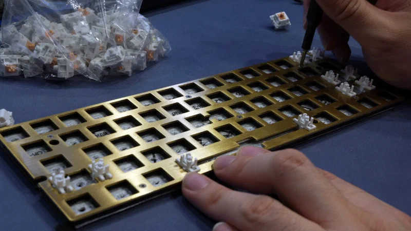 PE foam sheet placed over a keyboard PCB between the plate and switches
