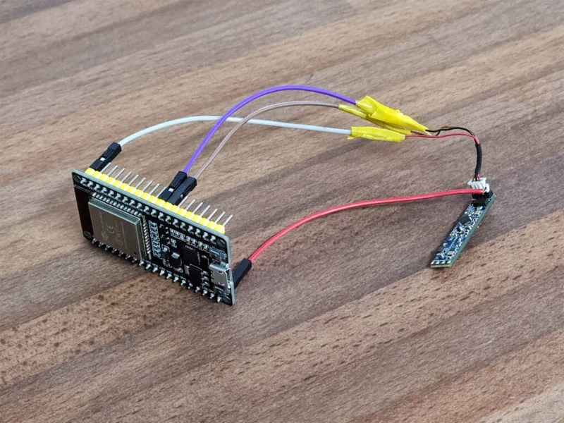 Assembled DIY presence sensor with LD2410 wired to an ESP32 development board for testing