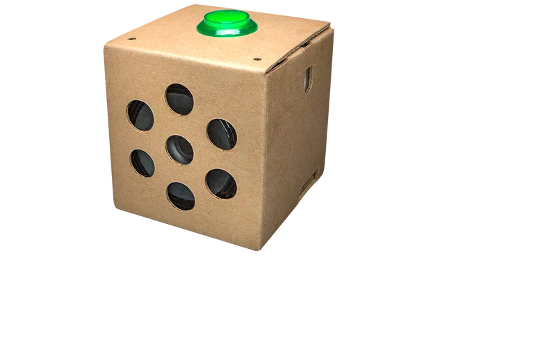 Google AIY Voice Kit fully assembled in its cardboard enclosure with button and speaker