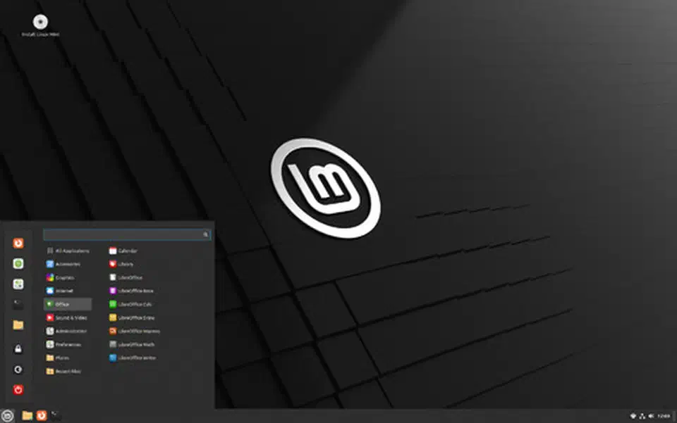 Linux Mint Cinnamon desktop with application menu open showing the dark theme and system tray