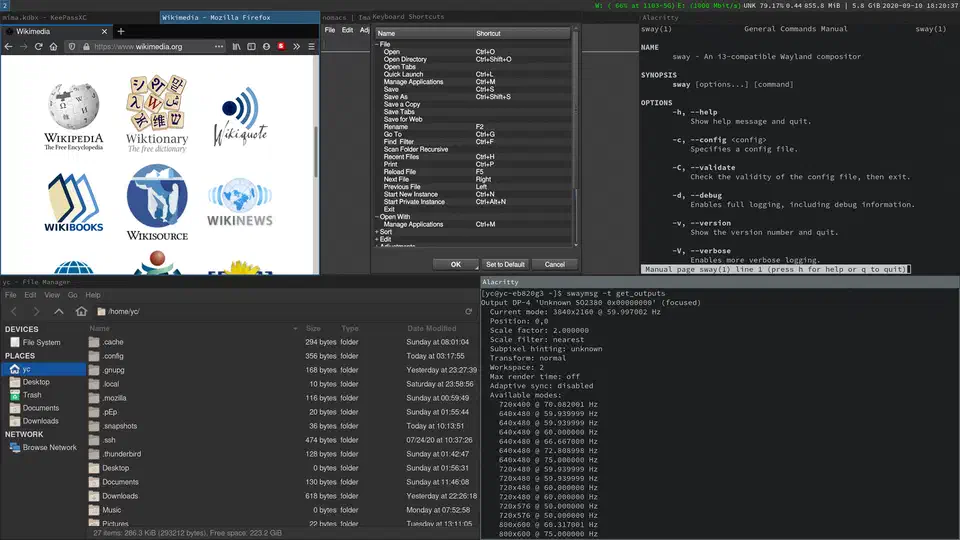Sway tiling compositor showing multiple terminal windows and applications arranged in a tiled layout