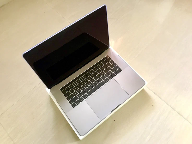15-inch MacBook Pro with Touch Bar sitting on its retail box