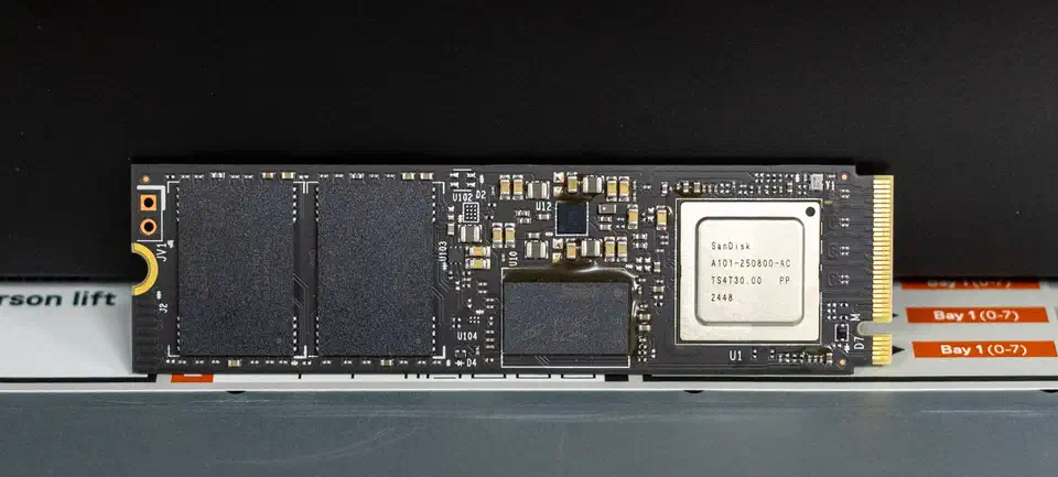 WD Black SN8100 NVMe SSD bare drive showing the controller and NAND flash chips