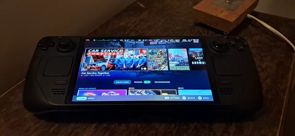 Steam Deck OLED handheld showing the Gamescope-driven SteamOS home screen