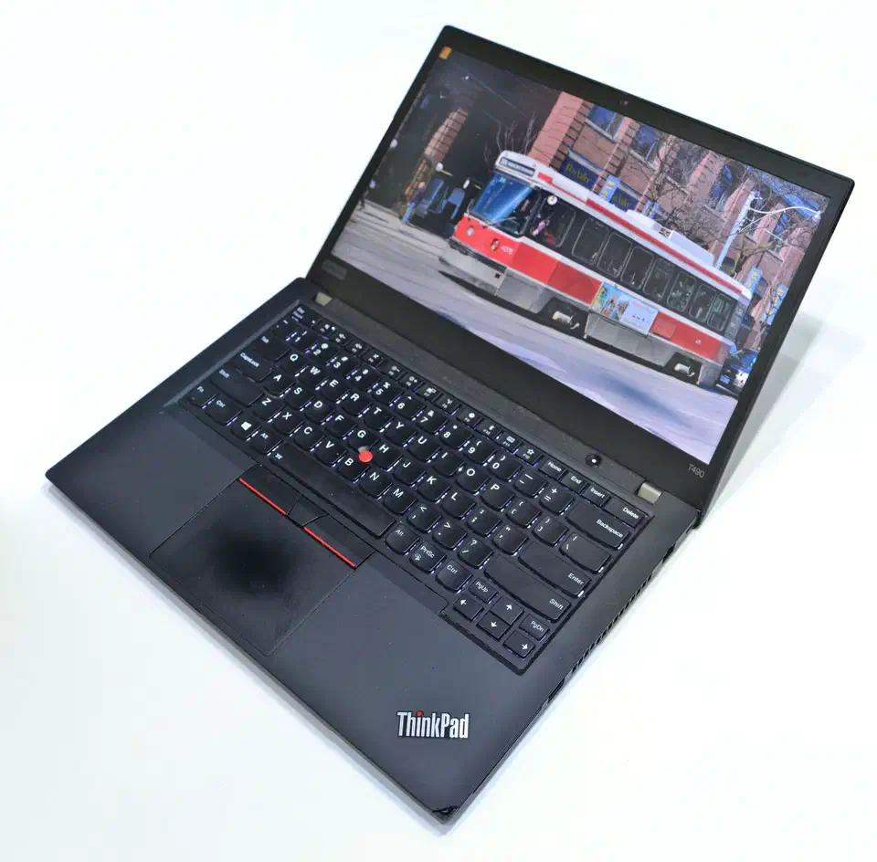 Lenovo ThinkPad T490 laptop with lid open showing the keyboard and display