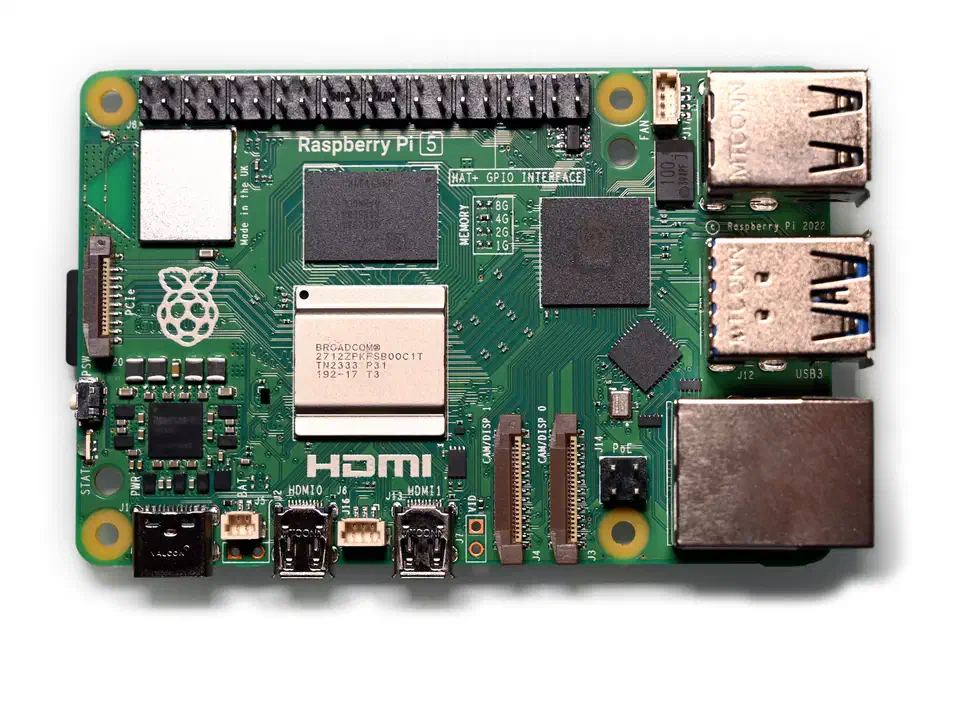 Raspberry Pi 5 board top-down view showing the Broadcom BCM2712 SoC, USB 3.0 ports, dual micro-HDMI, and 40-pin GPIO header