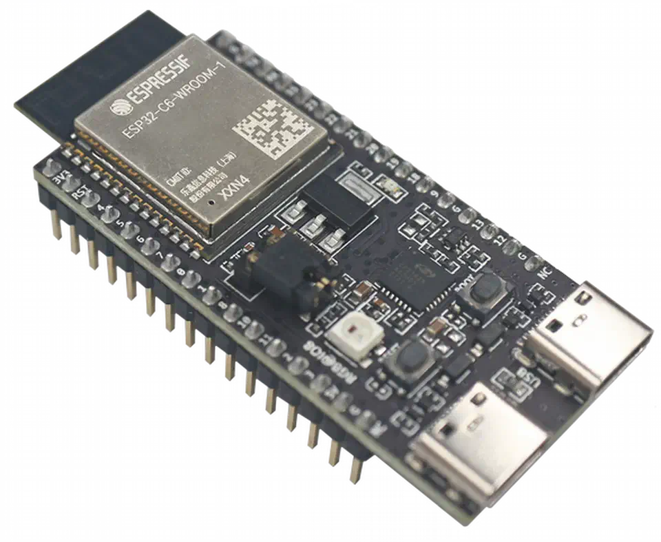 ESP32-C6-DevKitC-1 development board shown in an isometric render, with the ESP32-C6-WROOM module, two USB-C ports, and dual pin headers visible.