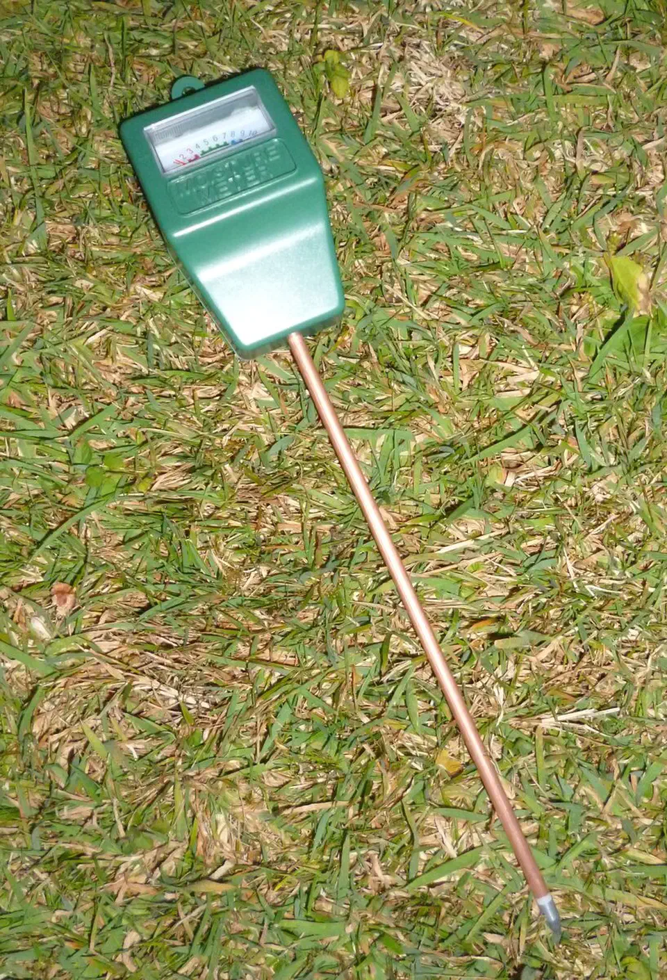 Capacitive soil moisture probe with its sealed measuring surface and three-pin header